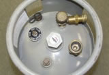 Fittings and valves on an industrial propane forklift cylinder