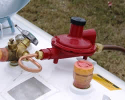 First stage regulator installed on a propane tank