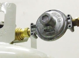 Low BTU propane regulator attached to a bottle
