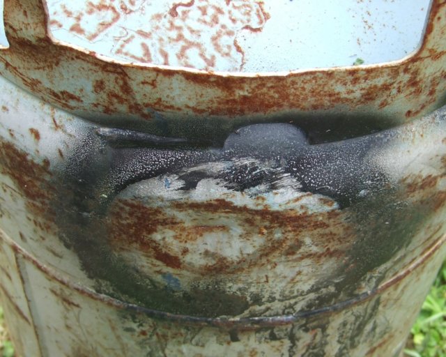 Gouged and dented propane cylinder