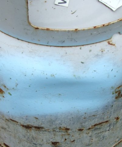 dented forklift propane bottle